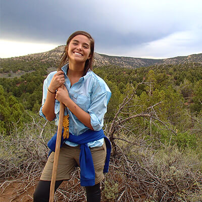 Expanse female student enjoying the day with a smile